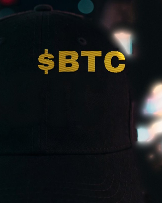 Lifestyle photo — $BTC cap at night